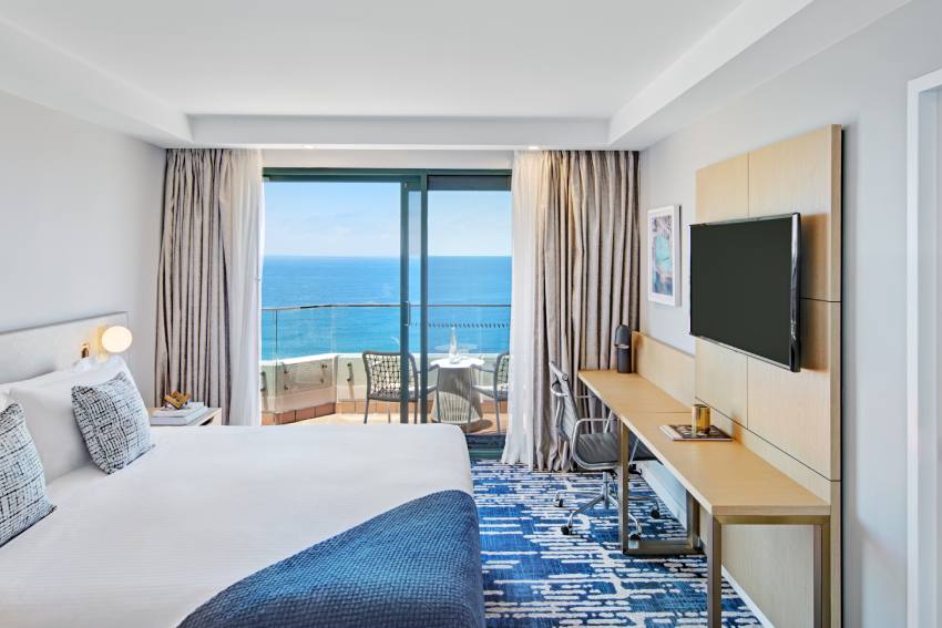 Seaside Suite ocean facing guestroom with flatscreen at Crowne Plaza Coogee